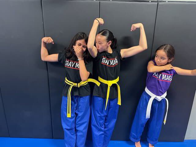 Kids martial arts class smiling after training session in Anaheim